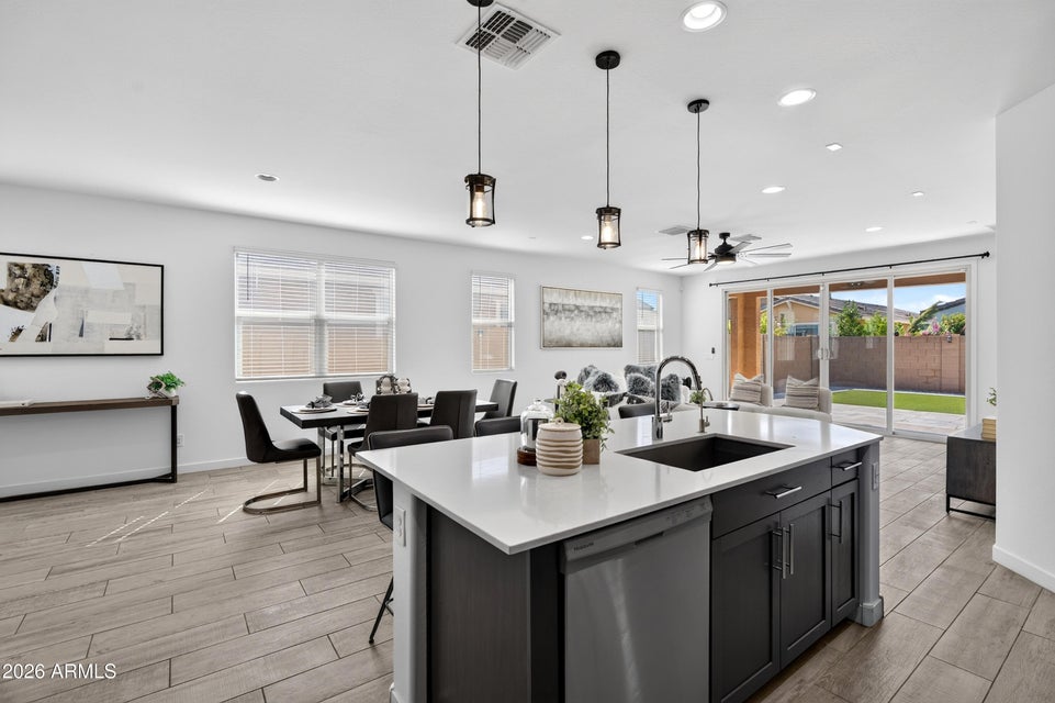 Kitchen and dining area with quartz island